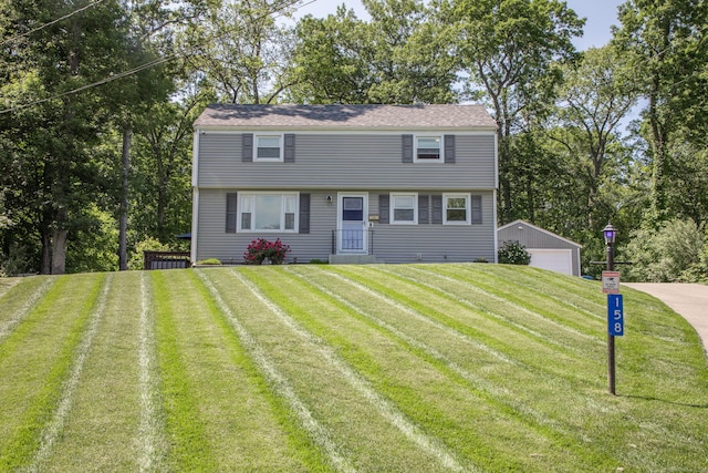 158 Jones Dr, New Britain, CT 06053 - colonial home with an outdoor structure, a front yard, and a garage