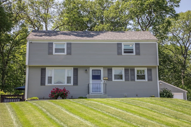 158 Jones Dr, New Britain, CT 06053 - colonial inspired home featuring a front lawn and roof with shingles
