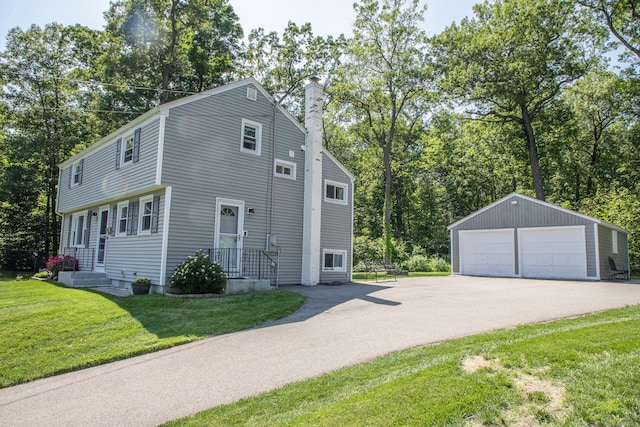 158 Jones Dr, New Britain, CT 06053 - view of side of home with an outbuilding, a detached garage, a chimney, a yard, and view of scattered trees