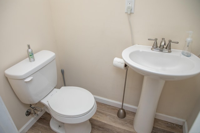 158 Jones Dr, New Britain, CT 06053 - bathroom with wood finished floors, toilet, and baseboards