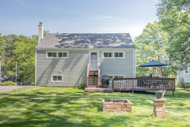 158 Jones Dr, New Britain, CT 06053 - view of front facade featuring a wooden deck, a chimney, a front yard, and a shingled roof