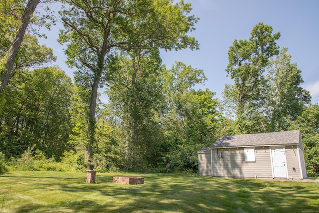 158 Jones Dr, New Britain, CT 06053 - view of green lawn with an outbuilding