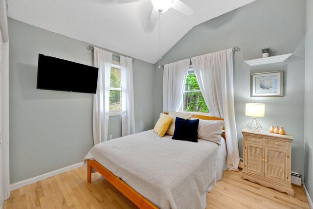 61 Pine Rd, Suffield, CT 06093 - bedroom featuring light wood-type flooring, vaulted ceiling, baseboards, baseboard heating, and ceiling fan