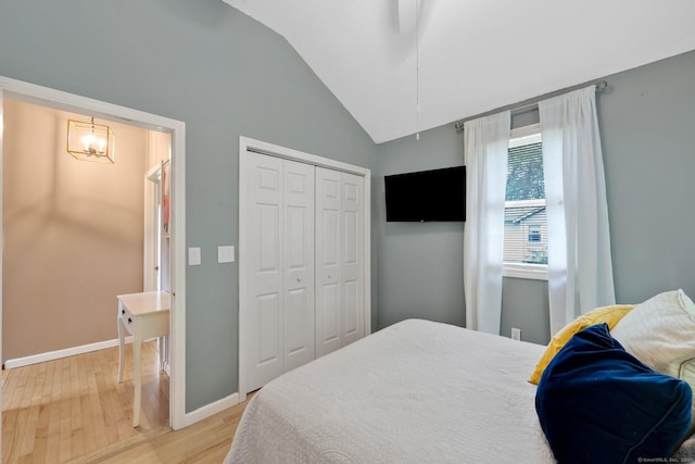 61 Pine Rd, Suffield, CT 06093 - bedroom featuring vaulted ceiling, light wood-style flooring, a chandelier, a closet, and baseboards