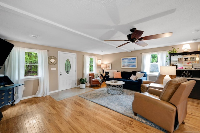 61 Pine Rd, Suffield, CT 06093 - living room with wood-type flooring, a ceiling fan, baseboards, and a textured ceiling