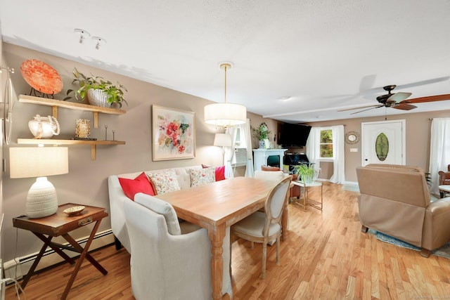 61 Pine Rd, Suffield, CT 06093 - dining area with light wood-type flooring, a ceiling fan, and a baseboard heating unit