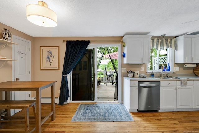 61 Pine Rd, Suffield, CT 06093 - kitchen featuring dishwasher, light countertops, light wood-style floors, baseboard heating, and white cabinets