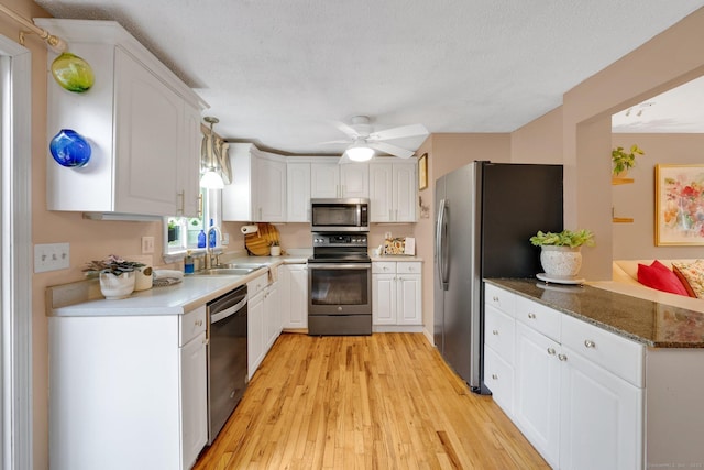 61 Pine Rd, Suffield, CT 06093 - kitchen featuring stainless steel appliances, a sink, and white cabinets