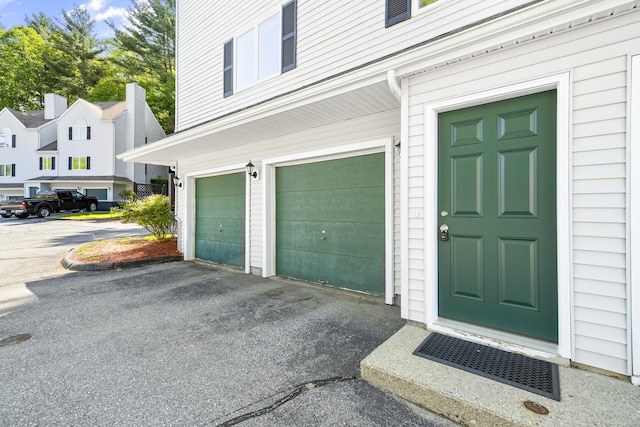 601 Whetstone Mls Unit 601, Killingly, CT 06241 - property entrance with an attached garage and driveway