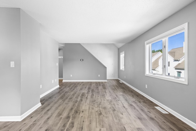 601 Whetstone Mls Unit 601, Killingly, CT 06241 - unfurnished living room featuring wood finished floors and baseboards