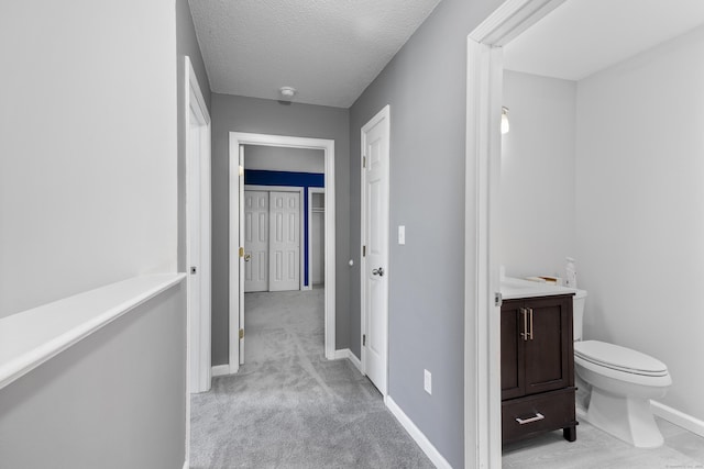 601 Whetstone Mls Unit 601, Killingly, CT 06241 - hall with baseboards and a textured ceiling