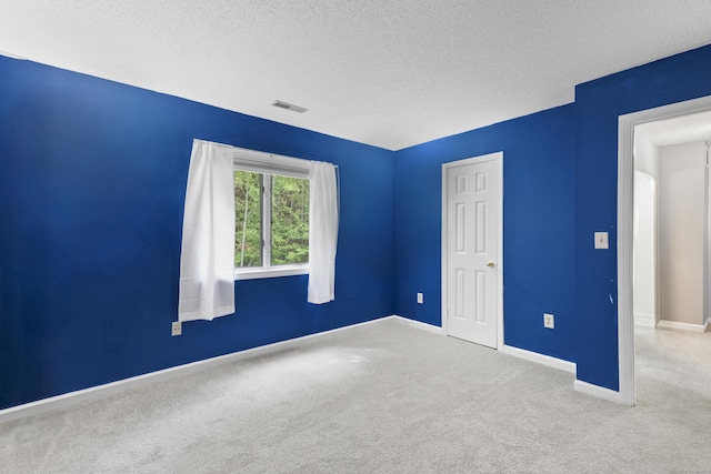 601 Whetstone Mls Unit 601, Killingly, CT 06241 - unfurnished bedroom featuring carpet flooring, a textured ceiling, and baseboards