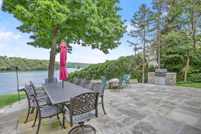 35 Knollcrest Rd, New Fairfield, CT 06812 - view of patio with outdoor dining area, a water view, and a view of trees