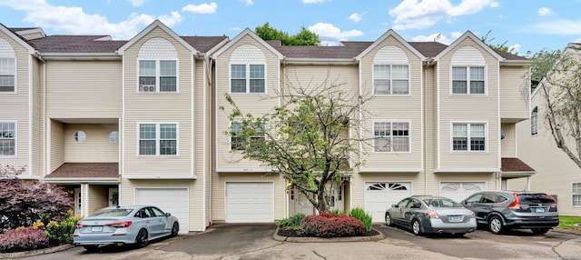 2390 State St Apt 6E, Hamden, CT 06517 - view of property with an attached garage and driveway
