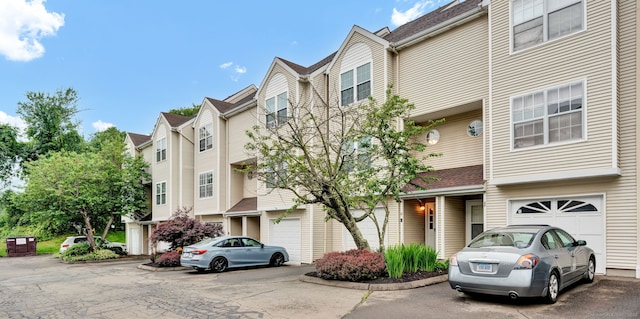 2390 State St Apt 6E, Hamden, CT 06517 - view of property with a garage, driveway, and a residential view