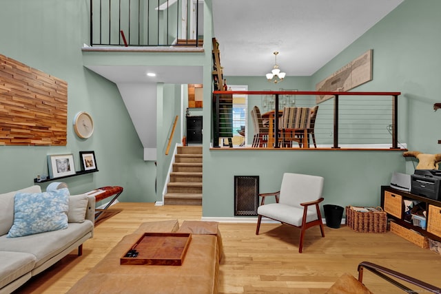 2390 State St Apt 6E, Hamden, CT 06517 - living room with wood finished floors, a chandelier, and stairway