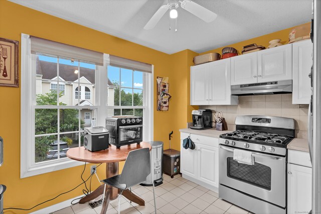 2390 State St Apt 6E, Hamden, CT 06517 - kitchen featuring stainless steel gas range oven, under cabinet range hood, light countertops, and white cabinets