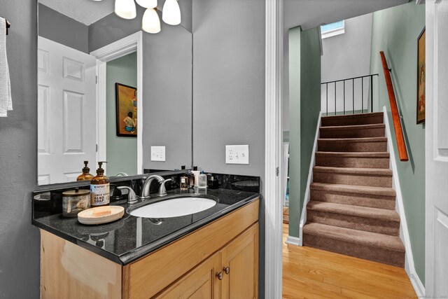 2390 State St Apt 6E, Hamden, CT 06517 - bathroom with wood finished floors and vanity