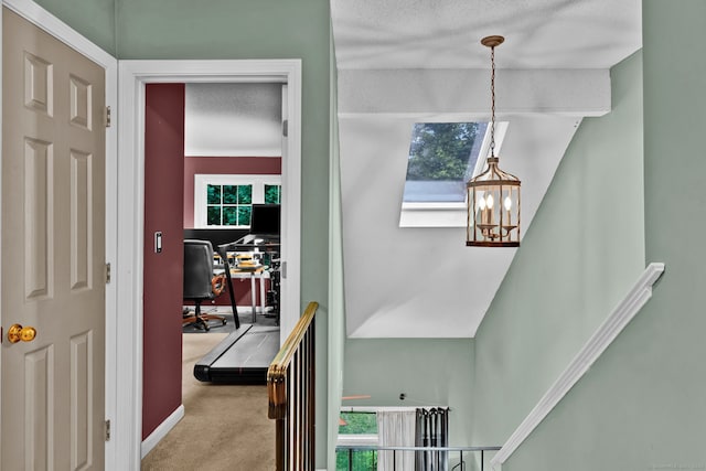 2390 State St Apt 6E, Hamden, CT 06517 - corridor featuring an office area, a textured ceiling, carpet, and healthy amount of natural light