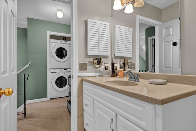 2390 State St Apt 6E, Hamden, CT 06517 - bathroom with stacked washer / drying machine and vanity