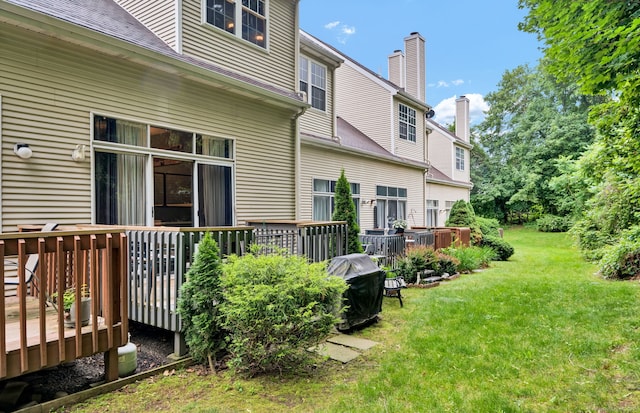 2390 State St Apt 6E, Hamden, CT 06517 - view of green lawn featuring a deck