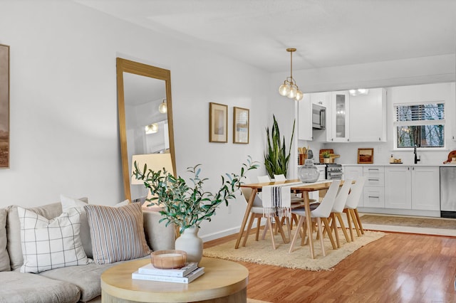 124 High Path Rd Unit 124, Windsor, CT 06095 - dining room featuring light wood-type flooring and baseboards