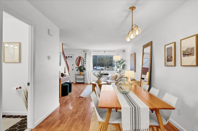 124 High Path Rd Unit 124, Windsor, CT 06095 - dining area featuring stairs, baseboards, and light wood-style floors