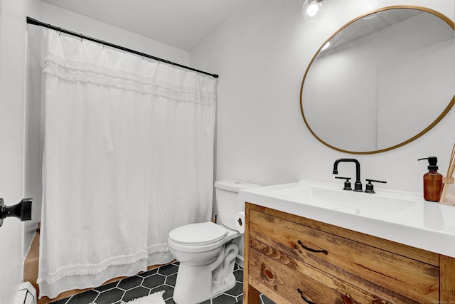 124 High Path Rd Unit 124, Windsor, CT 06095 - full bath featuring vanity, baseboard heating, toilet, and tile patterned floors