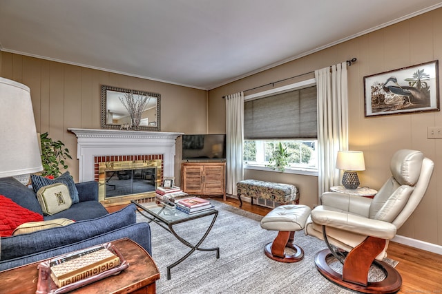 84 Kenwood Ave, Stratford, CT 06614 - living area with wood finished floors, crown molding, and a fireplace