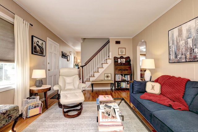 84 Kenwood Ave, Stratford, CT 06614 - living room featuring wood finished floors, crown molding, stairway, and arched walkways