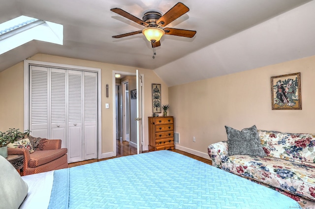 84 Kenwood Ave, Stratford, CT 06614 - bedroom featuring a skylight, vaulted ceiling, a closet, wood finished floors, and ceiling fan