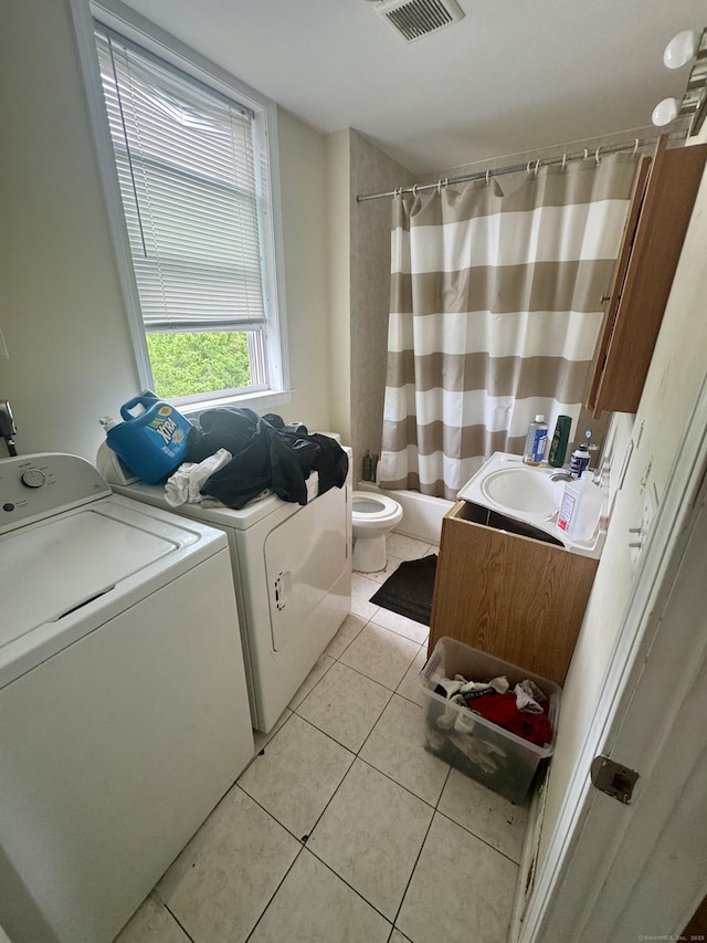 28 Terrace Ave, West Haven, CT 06516 - washroom featuring washer and dryer and light tile patterned flooring