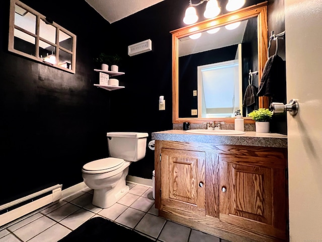 925 Oronoke Rd Unit 36G, Waterbury, CT 06708 - bathroom with baseboard heating, toilet, vanity, tile patterned flooring, and baseboards