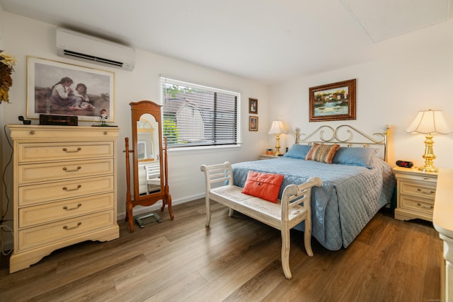 543 Heritage Vlg Unit A, Southbury, CT 06488 - bedroom featuring a wall unit AC and wood finished floors