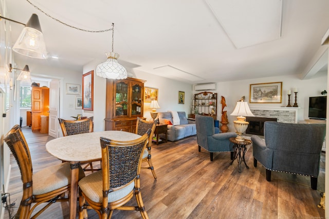 543 Heritage Vlg Unit A, Southbury, CT 06488 - dining area featuring wood finished floors and an AC wall unit