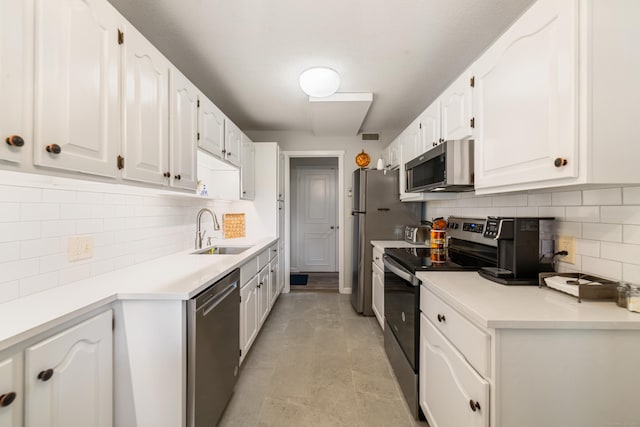 543 Heritage Vlg Unit A, Southbury, CT 06488 - kitchen featuring appliances with stainless steel finishes, white cabinets, tasteful backsplash, and light countertops