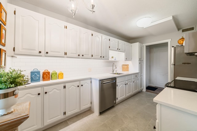 543 Heritage Vlg Unit A, Southbury, CT 06488 - kitchen with stainless steel dishwasher, freestanding refrigerator, white cabinetry, and light countertops