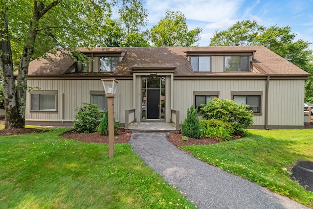 543 Heritage Vlg Unit A, Southbury, CT 06488 - view of front facade with a front yard and a shingled roof