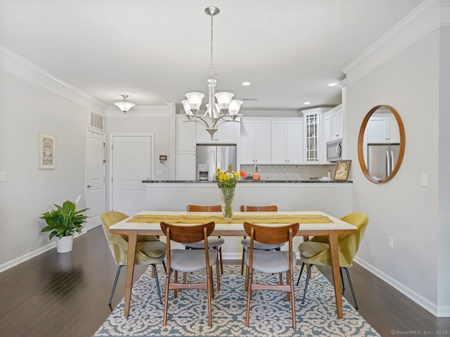 302 Center Meadow Ln Unit 302, Danbury, CT 06810 - dining area with dark wood-type flooring, a chandelier, crown molding, and recessed lighting