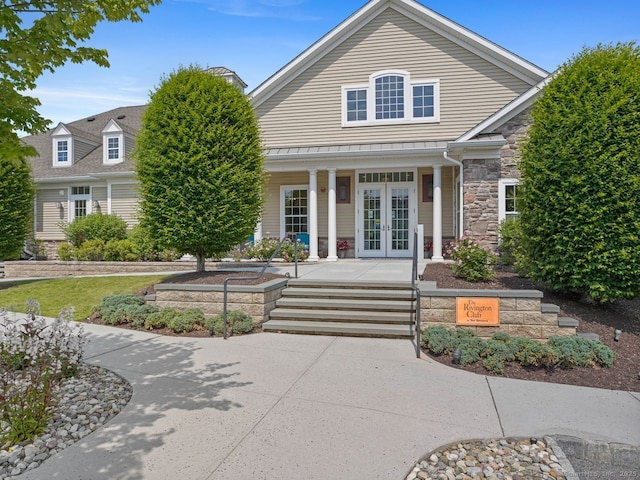 302 Center Meadow Ln Unit 302, Danbury, CT 06810 - view of front of property featuring french doors, covered porch, and stone siding
