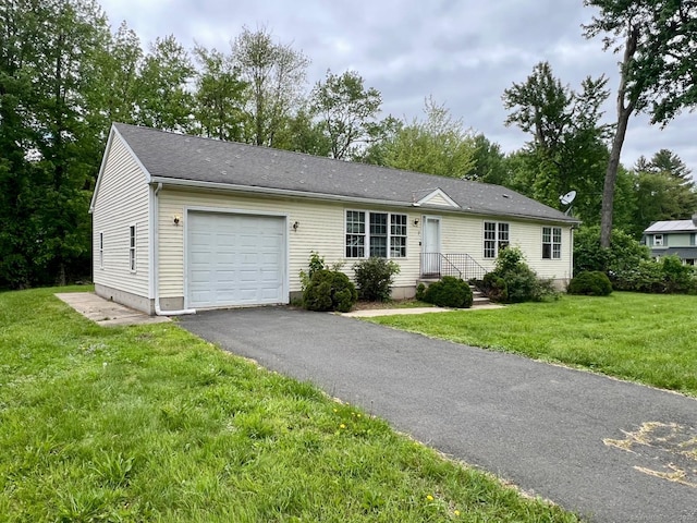 7 Emerson St, Bloomfield, CT 06002 - single story home featuring a garage, asphalt driveway, and a front lawn