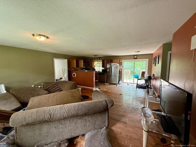 7 Emerson St, Bloomfield, CT 06002 - living room with a textured ceiling and light wood finished floors