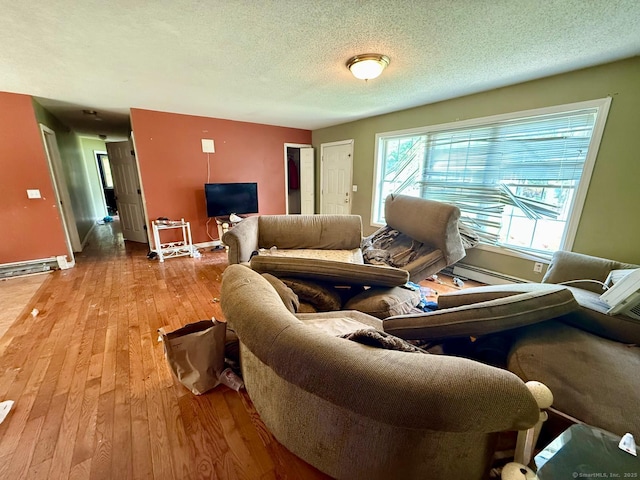 7 Emerson St, Bloomfield, CT 06002 - living room with light wood-style floors, baseboard heating, a textured ceiling, and baseboards