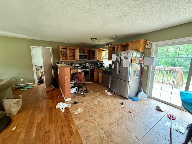 7 Emerson St, Bloomfield, CT 06002 - kitchen with appliances with stainless steel finishes, glass insert cabinets, open shelves, a textured ceiling, and brown cabinetry