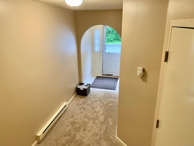 350 Bristol St Apt A3, Waterbury, CT 06708 - hallway with baseboard heating, baseboards, arched walkways, and carpet