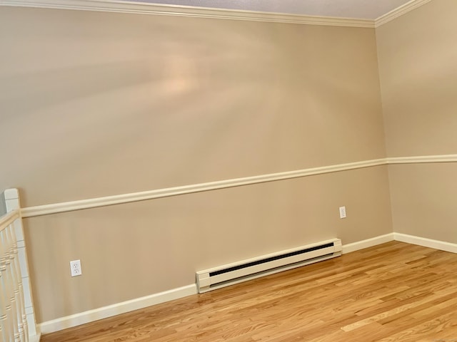 350 Bristol St Apt A3, Waterbury, CT 06708 - empty room with a baseboard heating unit, ornamental molding, light wood finished floors, and baseboards