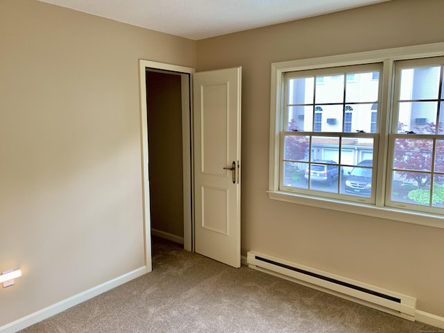 350 Bristol St Apt A3, Waterbury, CT 06708 - carpeted empty room with a baseboard radiator, plenty of natural light, and baseboards