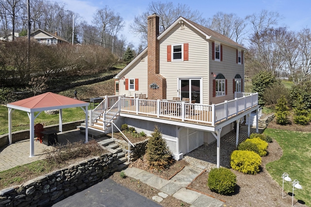 73 Lake Shore Dr, East Haddam, CT 06415 - rear view of property featuring a gazebo, a chimney, and a wooden deck