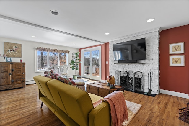 73 Lake Shore Dr, East Haddam, CT 06415 - living area with a stone fireplace, baseboard heating, wood finished floors, baseboards, and recessed lighting