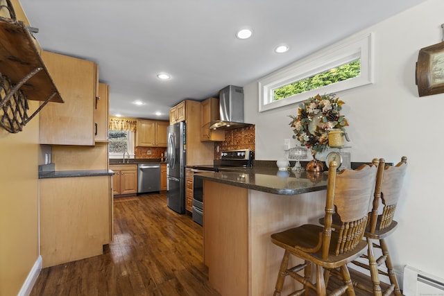 73 Lake Shore Dr, East Haddam, CT 06415 - kitchen with stainless steel appliances, wall chimney range hood, a baseboard heating unit, a peninsula, and a sink